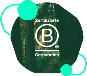 B Corp logo in front of trees